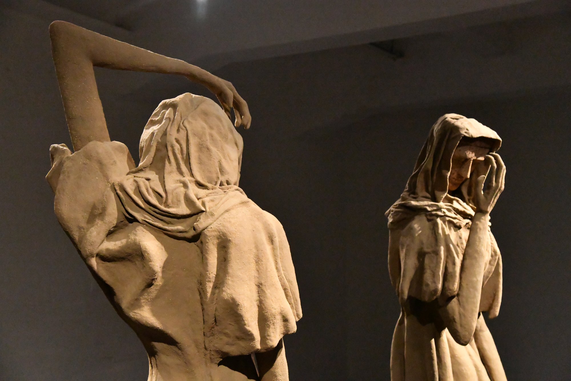 two veiled statues in a museum