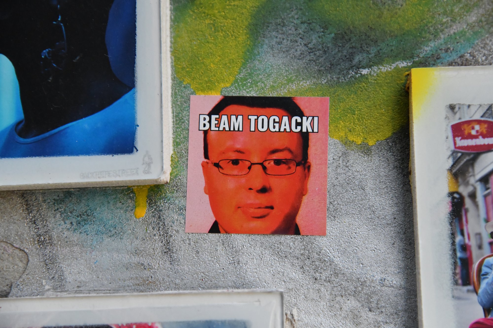 posters on a painted wall